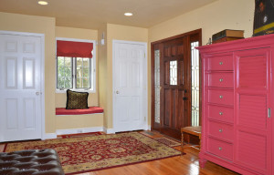 4 - Front entrance and sitting room with two guest cloets and window seat