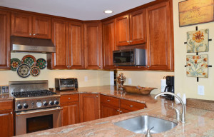 9 - Open kit. w-42 inch cherry cabinets, granite counters and stainless steel appliances